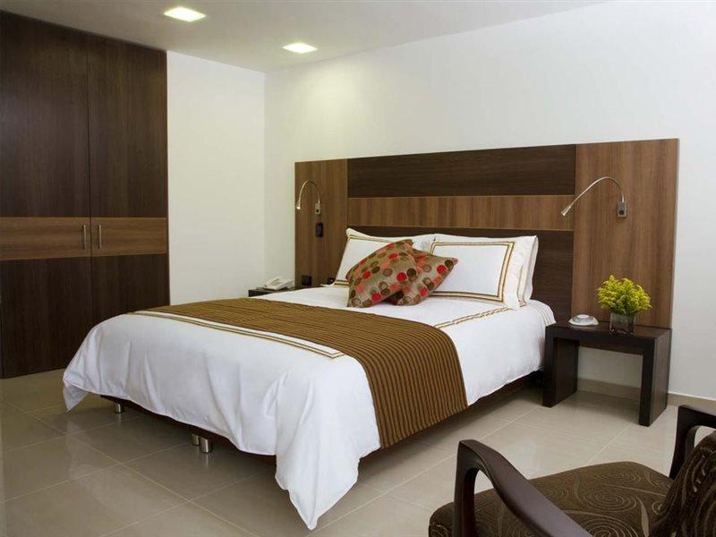 San Simon Hotel Pereira By Soratama Buitenkant foto A bedroom