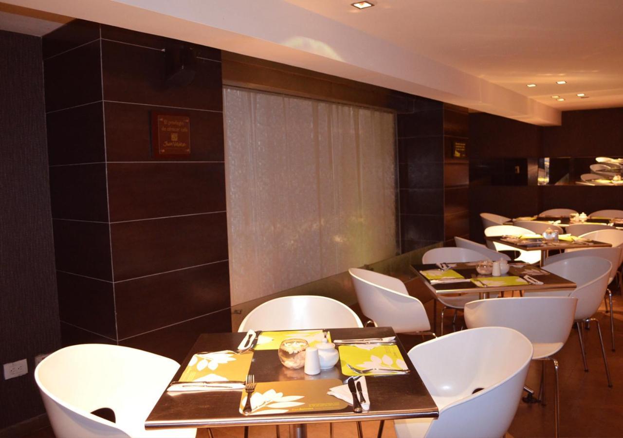 San Simon Hotel Pereira By Soratama Buitenkant foto The interior of the restaurant